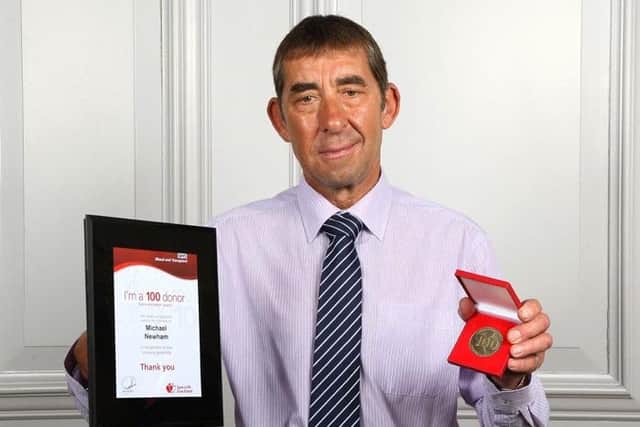 Melton man Michael Newham (67) received his award for reaching his 100th blood donation milestone EMN-160714-195940001
