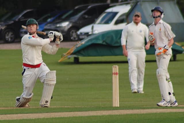 Thorpe's Myles Hickman sends one skywards watched by Belvoir keeper William Derby EMN-160720-111634002