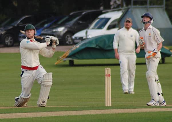 Thorpe's Myles Hickman sends one skywards watched by Belvoir keeper William Derby EMN-160720-111634002