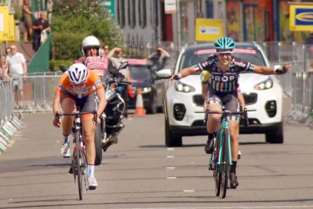 Rebecca Durrell crosses the finish line just ahead of Elizabeth Holden. EMN-160720-092247002