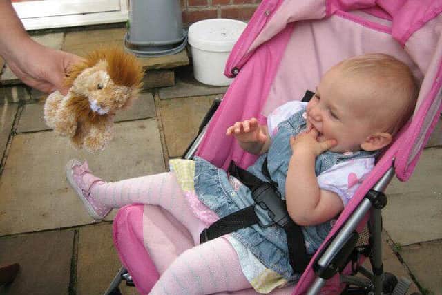 Lucie-Mai Baker, who died from encephalitis at the age of 17-months, pictured here with her pal Lion EMN-160720-144130001