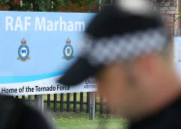 Armed police at RAF Marham today. Photo: PA