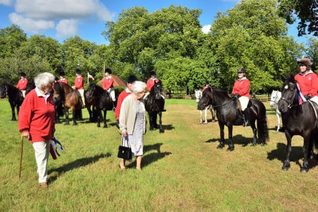 The Queen inspects the fell ponies. Tracey is immediately to the right of the Queen in this photo EMN-160725-100235001