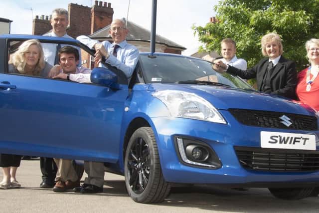 Local sponsors lending their valuable support are pictured with the Suzuki Swift prize. From left  Jane Gilhespy (Melton Building Society), Wayne Browning (Browning Suzuki), Joe Dixon (TTS Shipping), Stephen Jeal (NFU Mutual), Nick Davies (Pearces The Jewellers), Jenny Barnes (Richard Barnes Funeral Directors) Brina Tate (Lions President). EMN-160727-101036002