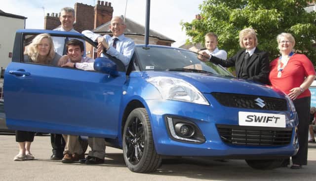 Local sponsors lending their valuable support are pictured with the Suzuki Swift prize. From left  Jane Gilhespy (Melton Building Society), Wayne Browning (Browning Suzuki), Joe Dixon (TTS Shipping), Stephen Jeal (NFU Mutual), Nick Davies (Pearces The Jewellers), Jenny Barnes (Richard Barnes Funeral Directors) Brina Tate (Lions President). EMN-160727-101036002