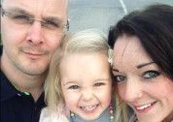 Parents Craig and Dani Woodward with daughter Poppy EMN-160727-124429001