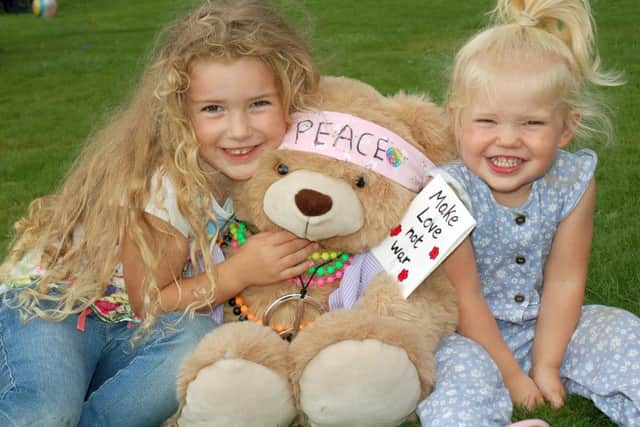 Evelyn and her sister Lillie Sage with their cuddly friend
PHOTO: Tim Williams