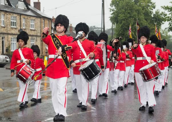 The Melton Toy Soldiers Band on the march at the Brackley Carnival procession last year EMN-160727-170725001