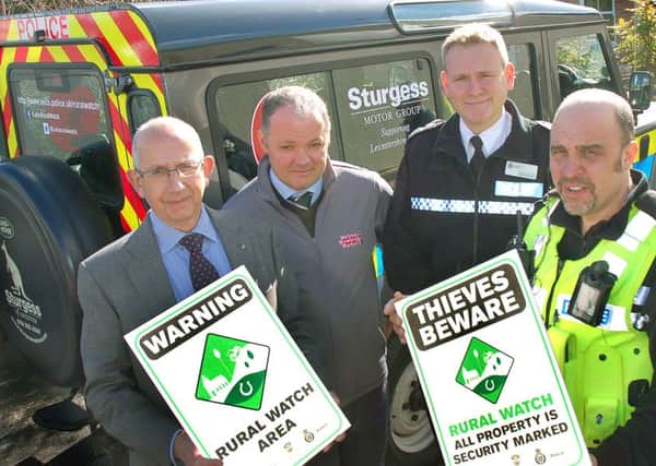 Pictured from left with some of the Rural Watch signs are Stephen Jeal, Melton NFU Mutual senior group secretary, Hugh Brown, cheif executive officer of Gillstream Markets Ltd which manages Melton Market, Leicestershire Police deputy chief constable Roger Bannister and Pc Mark Longden, dedicated neighbourhood officer covering the Vale of Belvoir EMN-160108-163902001