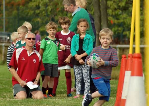 Minis coach Phil Wood helps out at a previous Try Rugby Day at Melton RFC EMN-160208-174445002