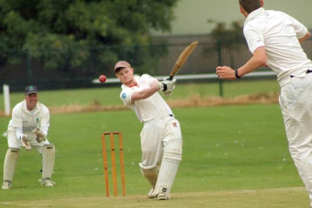 Man-of-the-match Myles Hickman sends one to the boundary during his match-winning innings as wicketkeeper David Greaves looks on EMN-160208-102324002
