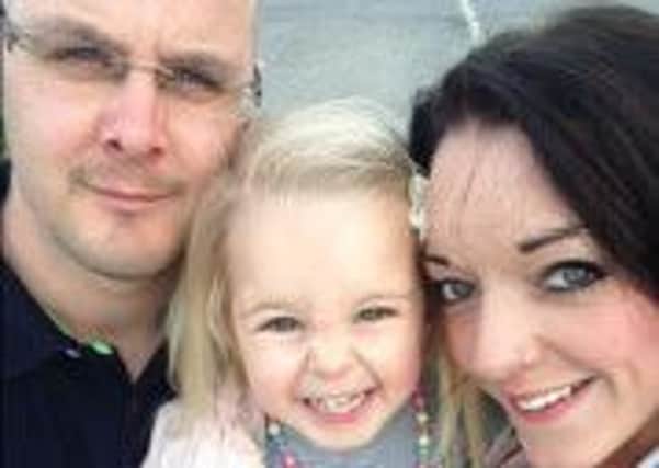Parents Craig and Dani Woodward with daughter Poppy-May EMN-160208-165146001