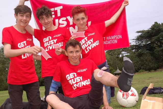 Alex Baker, Sam Hopwood and Jack Hoare in charge of Charlie Hudson's leg waxing
PHOTO: Tim Williams
