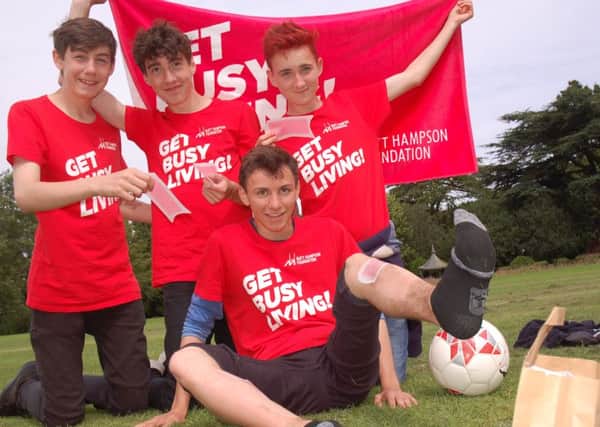Alex Baker, Sam Hopwood and Jack Hoare in charge of Charlie Hudson's leg waxing
PHOTO: Tim Williams