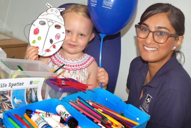 Maisie Spencer-Watling makes her mask with Wildlife Trust educational officer Zaheera Iqbal
PHOTO: Tim Williams