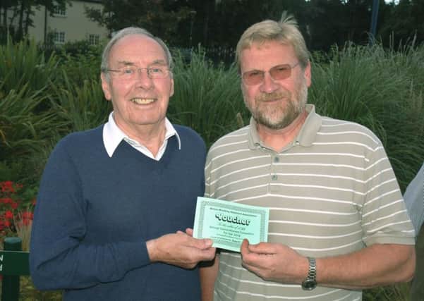 Roger Stocks accepts his vouchers for The Crescent on behalf of wife Christine from judge Barry Cook PHOTO: Tim Williams