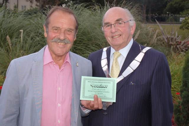 Peter Breeze is presented with his Victoria Street vouchers by Melton Mayor David Wright PHOTO: Tim Williams