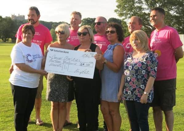 Representatives from Cancer Research, St Barnabas Hospice and Dove Cottage Hospice with, back from left, Knipfest committee members Phil Noon, Richard Hart, John Copley, Johnnie Watchorn and Greg Herbert who handed over the cheque EMN-160815-122945001