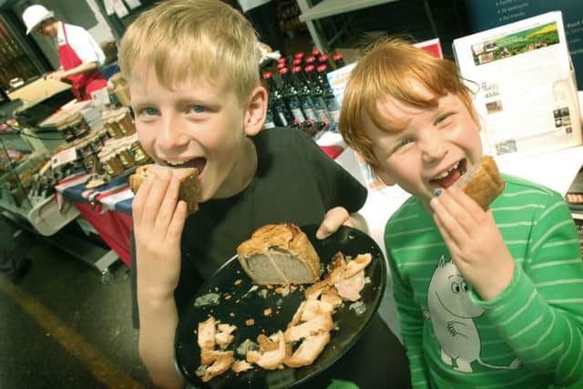 Young pork pie fans Daniel Bystrom and sister Anna show how festival tasting should be done EMN-160815-093401001