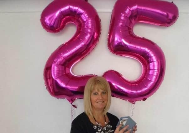 Mandy Cross is celebrating after reaching her 25th anniversary as a Slimming World consultant and achieving the prestigious Gold Award again in her Melton Morning Group, her fifth and final group to do so EMN-160816-093011001