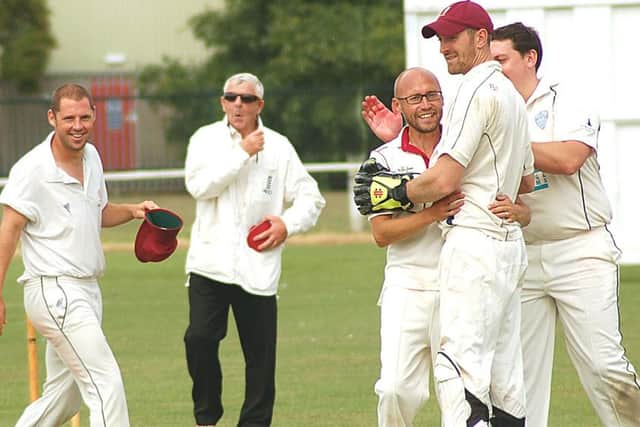 Melton players celebrate with James EMN-160816-125452002