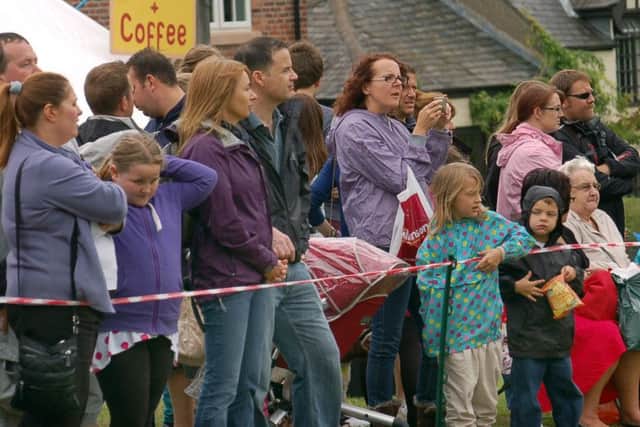 Crowds watch the action on the village green at Old Dalby Day
PHOTO: Tim Williams