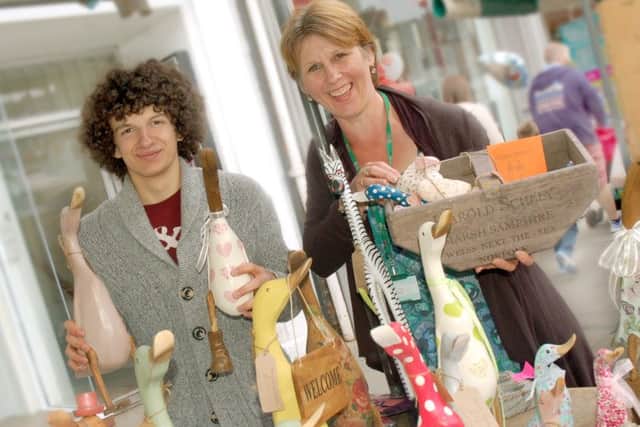 Joe Butler and Shelagh Core with wooden decorations on the Alright Ducky stall at the previous Teenage Market in Melton PHOTO: Tim Williams
