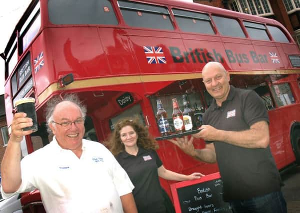 Bar Bus owners Nelly Miles and Wayne Hollobone supply 103 The Eye presenter Peter Treadwell with refreshment 
PHOTO: Tim Williams