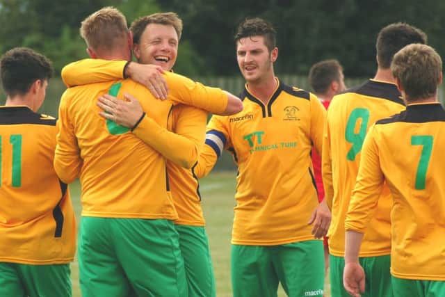 Holwell's star man Michael Stevenson is congratulated by Ian Bitmead after putting Holwell 3-0 up EMN-160823-093135002