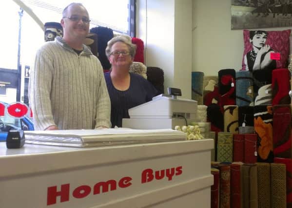 Jonathan Webb and his mum Irene at the new Home Buys store in Melton's The Mall shopping centre ENGEMN00120130916172535