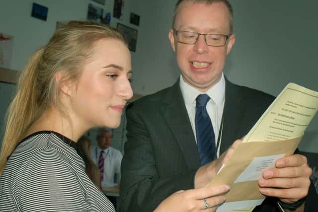 Principal Chris Haggett chats with a pleased Lauren Garner.