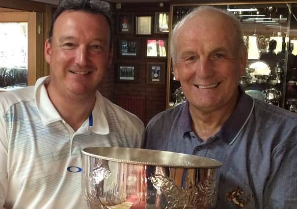 Duncan Bradshaw presents the Bagshaw Bowl, in memory of his father, to 2016 winner Phil White EMN-160829-172654002