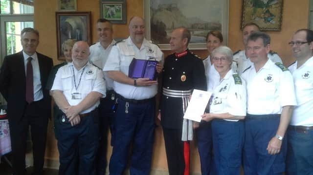 Sir John Peace, Lord Lieutenant of Nottinghamshire, presents The Queen's Award for Voluntary Service to the Vale First Responders.
Also pictured, congratulating the Vale First Responders, are East Midlands Ambulance Service's chief operating officer David Whiting (far left), EMAS' Mandy Lowe (second from left) and Anthony Belling (third from right). The Vale First Responders in the picture are Rowan Bird, Mark Onyett, Rod Whitehead (chairman), Lesley Onyett, Gill Clark, Peter Savage and James Buck EMN-160509-134310001
