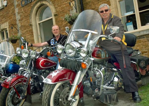 Landlord Alan Edmonds and Bob Wood from the Air Ambulance sit astride classic Harley Davidsons PHOTO: Tim Williams