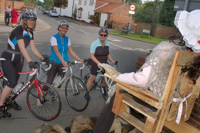Cyclists Ali Oldfield, Sandy Roy and Maria Dobney stop to admire one of the High Street creations
PHOTO: Tim Williams