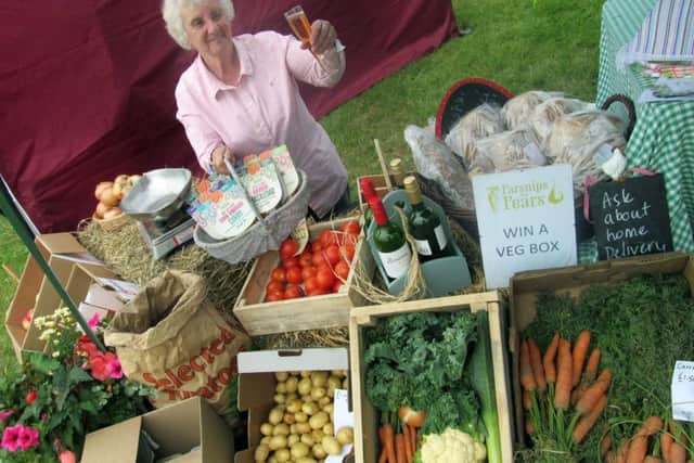 Jenny Eyre takes some refreshment whilst running the Parsnips and Pears produce stall
PHOTO: Tim Williams EMN-150914-101057001