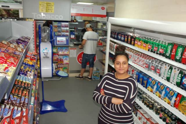 Postmaster Kruba Theba in the new look Post Office and store EMN-160509-120751001