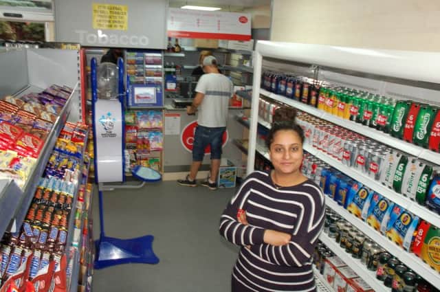 Postmaster Kruba Theba in the new look Post Office and store EMN-160509-120751001