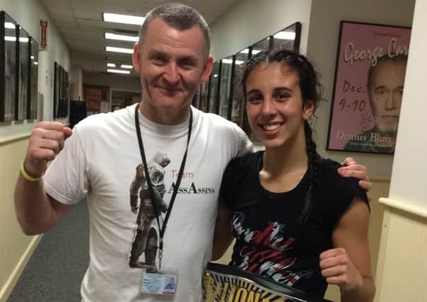 Iman Barlow with dad and coach Mark and her 12th world title belt EMN-160709-094729002