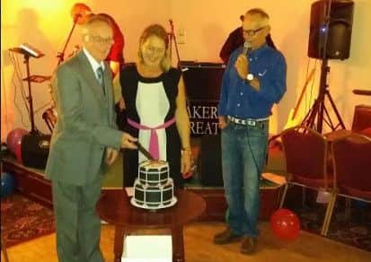 Mick Short and Karen Joyce cut the cake to mark the Melton Mowbray Tally Ho Marching Band's 80th anniversary PHOTO: Supplied