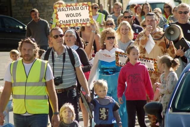 Waltham school children and parents parade down High Street to open the fair at the village hall at last year's event
PHOTO: Tim Williams