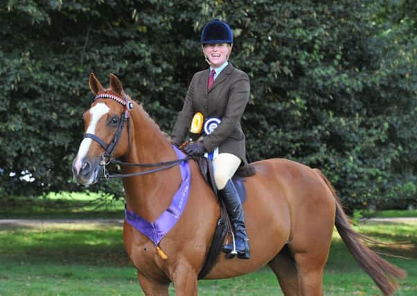 New mum Lizzie Harris and Wild West will compete at the Horse of the Year Show for the second year running EMN-160909-174235002