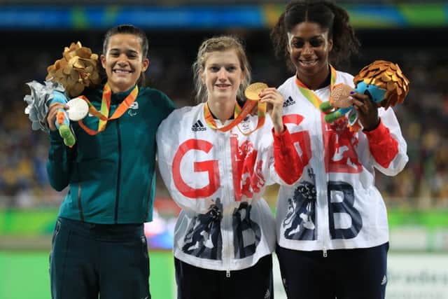 Sophie Hahn on the top step of the podium flanked by good friend Veronica Hipolito (left) and GB team-mate Kadeena Cox PICTURE: Adam Davy/PA EMN-160914-093817002