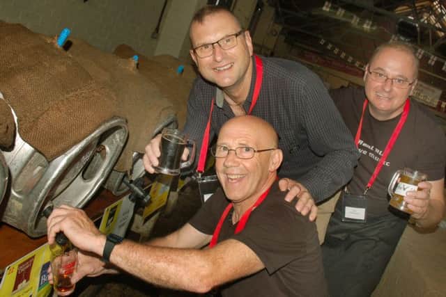 CAMRA members Harvey Hopwood, Kevin Bilson and Pete Wilkinson keep the beer flowing PHOTO: Tim Williams