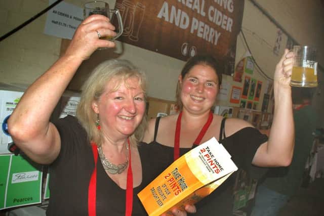Teresa Pullan and Kelly Spencer raise a glass to another successful Beer Festival PHOTO: Tim Williams