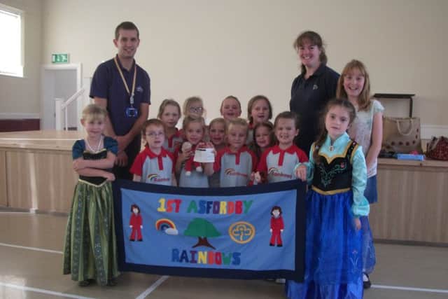 The 1st Asfordby Rainbows have presented Gary Farnfield, community fundraiser for the Rainbows Hospice for Children and Young People, with £220 PHOTO: Supplied