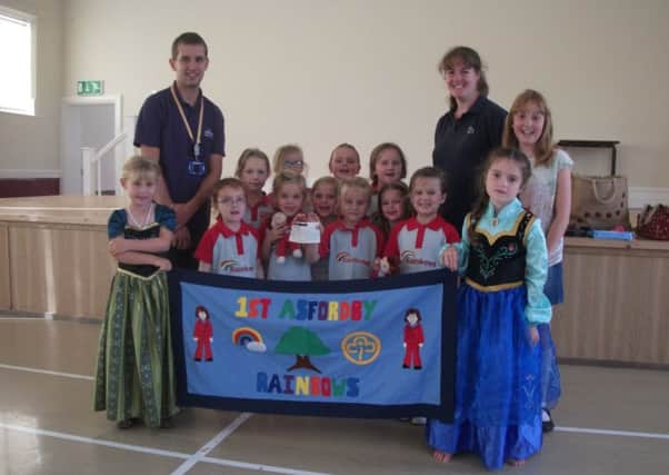 The 1st Asfordby Rainbows have presented Gary Farnfield, community fundraiser for the Rainbows Hospice for Children and Young People, with Â£220 PHOTO: Supplied
