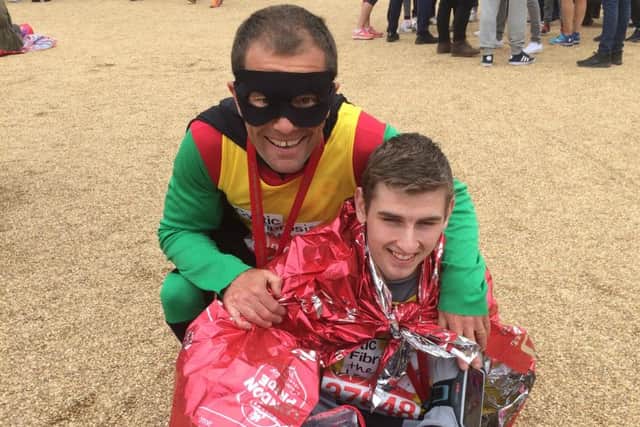 Paul Jacobs (aka Robin) and Joe Pope (aka Batman) after their London Marathon dressed as the dynamic duo