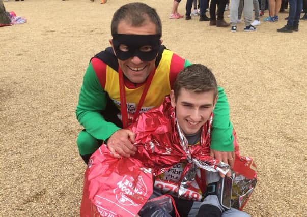 Paul Jacobs (aka Robin) and Joe Pope (aka Batman) after their London Marathon dressed as the dynamic duo