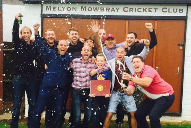 Jubilant Melton Mowbray Cricket Club players crack open the bubbly as their league title success is confirmed on Saturday afternoon EMN-160920-103029002